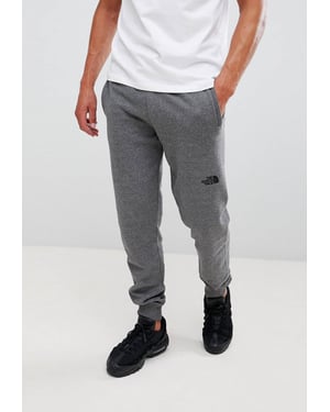 The North Face NSE Heren Fleece Cuffed Joggers Pant Grijs