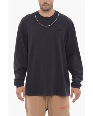 T-shirt met lange mouwen, ronde hals en zilverkleurige ketting in blauw