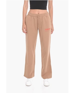 Wijde WORKSHOP-joggingbroek met logoprint in beige