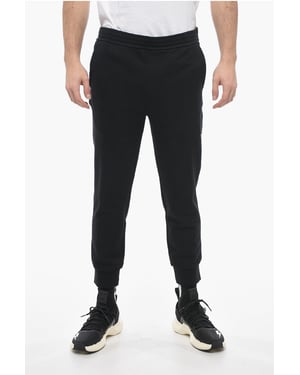 Skinny joggingbroek van katoen met boorden in zwart