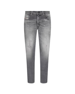Diesel Mannen 1979 Sleenker Vervaagde Franje Rand Jeans (Grijze Denim)