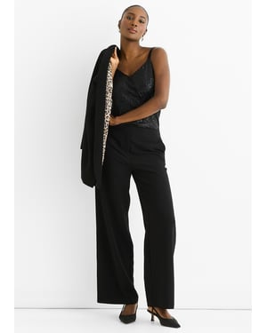 Zwarte cape-blazer met contrasterende dierenprint voering