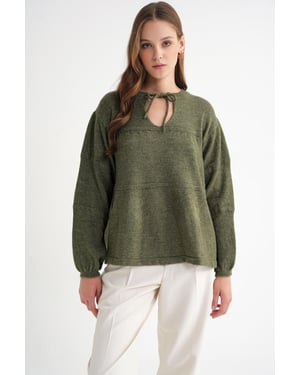 V loose knit sweater met strikdetails