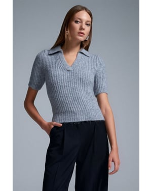 Vrouwen Aansluitende Geribbelde Polo Sweater