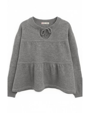 V loose knit sweater met strikdetails
