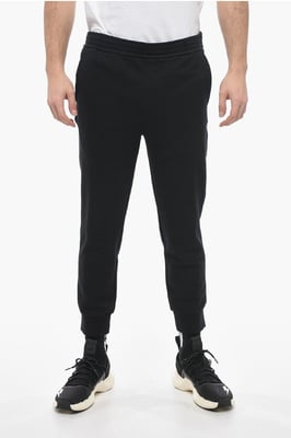 Skinny joggingbroek van katoen met boorden in zwart