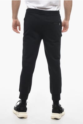 Skinny joggingbroek van katoen met boorden in zwart