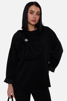 Zwarte oversized trui met contrasterende strik aan de zijkant