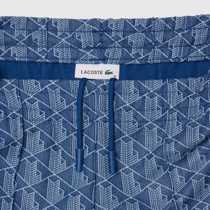 Lacoste flared joggingbroek met Monogram-motief voor dames in blauw