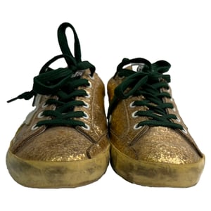 Golden Goose Super Star lage sneakers in metallic goudkleurige glitter.
