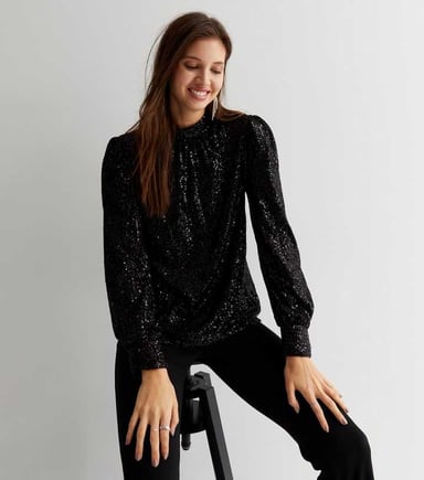 Loosefit blouse met hoge hals en pailletten