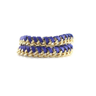 Ettika - Geelgouden armband met blauwe lederen linten en een kristal