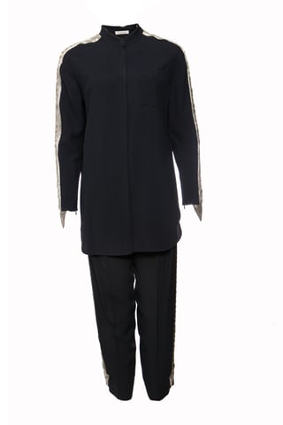 Chloe, Dark blue trousers (36/XS) and blouse (38/S) with silver embroidery along the sleeves and legs.