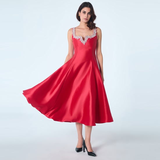 Cocktailjurk met hartvormig decolleté en kralen - Image 1