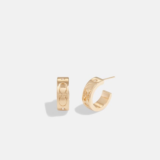 Kissing C Small Huggie Earrings - Image 1