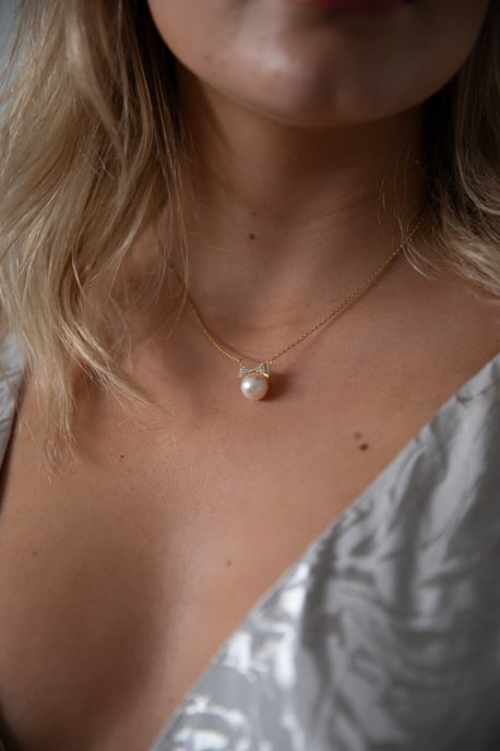 Pearl Bow Tie Necklace in Gold