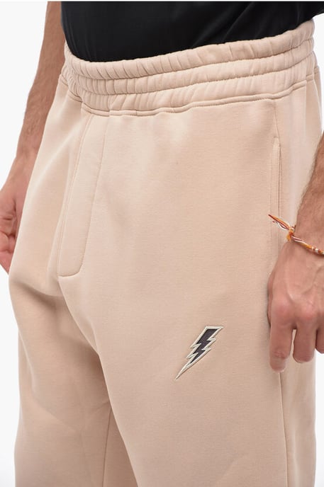 Geborduurde BOLT-joggingbroek met rits aan de manchetten in beige - Image 3