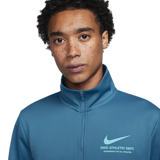 Nike-branding Op De Achterkant Van Een Blauw Trainingsjack Met Rits - Image 3