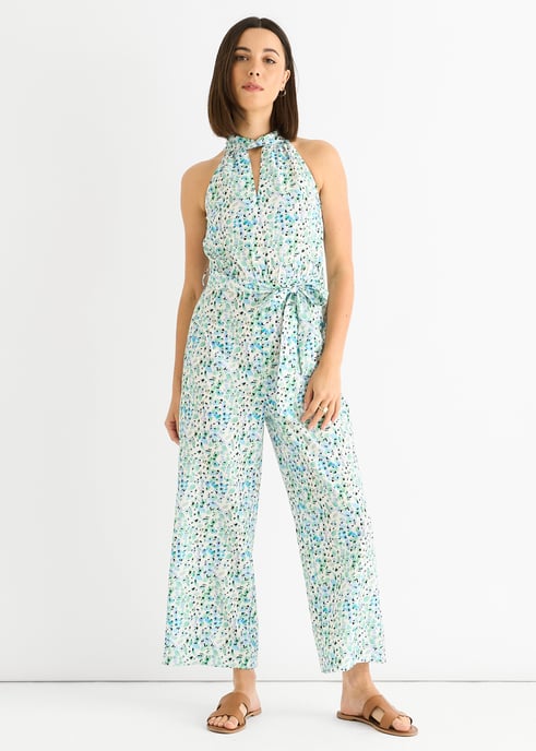 Blauwe jumpsuit met bloemenprint en halternek - Image 1