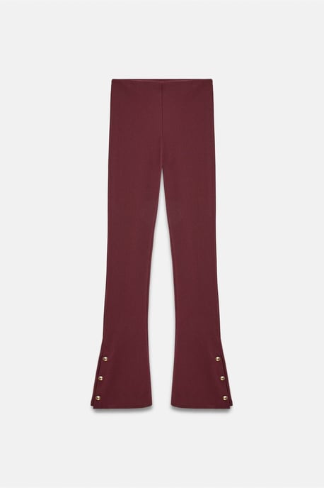 Hoog-getailleerde flare leggings met knoopdetail - Image 4