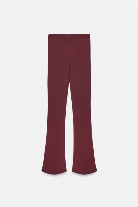 Hoog-getailleerde flare leggings met knoopdetail - Image 5