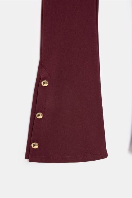 Hoog-getailleerde flare leggings met knoopdetail - Image 6