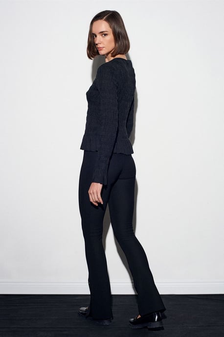Hoog-getailleerde flare leggings met knoopdetail - Image 3